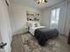 Cozy bedroom features a comfortable bed, artwork and neutral colored walls at 4490 S Montana Dr, Chandler, AZ 85248