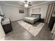 Bright bedroom featuring a ceiling fan, bed, and carpet at 4490 S Montana Dr, Chandler, AZ 85248