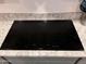 Bosch black cooktop installed over granite countertops in kitchen at 4490 S Montana Dr, Chandler, AZ 85248