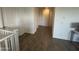 Upstairs hallway with wood look tile flooring and several doors providing access to other rooms at 4490 S Montana Dr, Chandler, AZ 85248