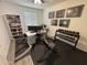 Home gym and office space featuring weight equipment, a desk, and shelving at 4490 S Montana Dr, Chandler, AZ 85248
