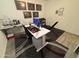 Home office and gym featuring a desk, weight equipment, and decorative artwork at 4490 S Montana Dr, Chandler, AZ 85248