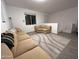 Upstairs living room with tile floors, neutral walls and a comfy tan sofa at 4490 S Montana Dr, Chandler, AZ 85248