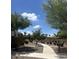 The neighborhood features lush landscaping with a paved walkway throughout the yards, creating a park-like setting at 4490 S Montana Dr, Chandler, AZ 85248