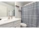 Bathroom featuring a white vanity, toilet and shower/tub combo with stylish shower curtain at 4518 W Carson Rd, Laveen, AZ 85339