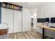 This bedroom features a closet, workspace and a laundry area behind an open door at 4518 W Carson Rd, Laveen, AZ 85339