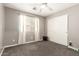 Neutral bedroom with ceiling fan, neutral carpet, and closet with sliding doors at 4518 W Carson Rd, Laveen, AZ 85339