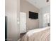 Relaxing primary bedroom showing a TV and open entrance to the en-suite at 4518 W Carson Rd, Laveen, AZ 85339