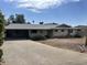 Single-story home with a carport and desert landscaping; a promising fixer-upper with great potential at 4808 N 69Th St, Scottsdale, AZ 85251