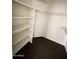 Spacious walk-in closet with multiple shelves offers abundant storage for clothes and accessories at 4850 E Desert Cove Ave # 241, Scottsdale, AZ 85254
