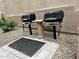 Community outdoor grilling area with two built-in grills and a small table for convenient barbecues at 4850 E Desert Cove Ave # 241, Scottsdale, AZ 85254
