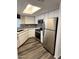 This updated kitchen features stainless steel appliances, great countertops, and sleek wood-look flooring at 4850 E Desert Cove Ave # 241, Scottsdale, AZ 85254