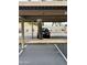 Covered parking spot in community with mature tree growing in parking spot at 4850 E Desert Cove Ave # 241, Scottsdale, AZ 85254