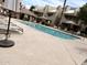 Community pool surrounded by lounge chairs and well-maintained landscaping for relaxation and leisure at 4850 E Desert Cove Ave # 241, Scottsdale, AZ 85254