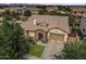 Aerial view of a single-Gathering home showcasing its landscaping, roof, and surrounding neighborhood at 6299 S Roanoke St, Gilbert, AZ 85298