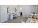 Bedroom featuring a workstation, plank flooring, and a daybed with floral pillows at 6299 S Roanoke St, Gilbert, AZ 85298