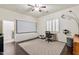 Bedroom featuring wood floors, a media center, a toy car, and a desk at 6299 S Roanoke St, Gilbert, AZ 85298
