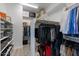 Organized walk-in closet with shelves and racks for optimal storage of clothes and accessories at 6299 S Roanoke St, Gilbert, AZ 85298