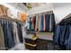 Organized walk-in closet with ample storage solutions including shelving, hanging rods, and bins at 6299 S Roanoke St, Gilbert, AZ 85298