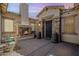 Inviting outdoor courtyard with a cozy fireplace, elegant stone accents, and stylish decorative potted plants at 6299 S Roanoke St, Gilbert, AZ 85298