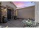 Tranquil outdoor courtyard featuring a wrought iron gate, tasteful decor, and ample space for relaxing and entertaining at 6299 S Roanoke St, Gilbert, AZ 85298