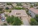 A beautiful home boasts a well-manicured front yard and landscaping, alongside a backyard play area at 6299 S Roanoke St, Gilbert, AZ 85298