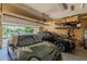 Garage with two cars, overhead storage, and an automatic garage door opener at 6299 S Roanoke St, Gilbert, AZ 85298
