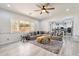 Inviting living room featuring a large sectional, open layout, and view into the kitchen at 6299 S Roanoke St, Gilbert, AZ 85298