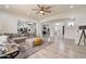 Open-concept living space showcasing stylish furnishings and seamless flow into adjacent rooms at 6299 S Roanoke St, Gilbert, AZ 85298
