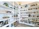 Well-organized walk-in pantry with ample shelving and clear storage containers for easy access at 6299 S Roanoke St, Gilbert, AZ 85298