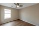 Simple bedroom with wood flooring and window to allow natural light, perfect for peaceful relaxation at 6434 W Riva Rd, Phoenix, AZ 85043