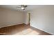 Bright bedroom features wood floors and ceiling fan at 6434 W Riva Rd, Phoenix, AZ 85043