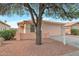 Charming single-story home with a desert landscape, complemented by a two car garage and a welcoming front entrance at 6434 W Riva Rd, Phoenix, AZ 85043
