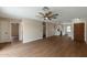 Spacious living room featuring wood floors, and an elegant ceiling fan at 6434 W Riva Rd, Phoenix, AZ 85043