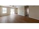 Bright living room features wood floors and sliding glass door at 6434 W Riva Rd, Phoenix, AZ 85043