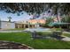 Beautiful backyard featuring a well-maintained lawn, patio, pool, and lounge area, perfect for outdoor enjoyment at 6911 E Thunderbird Rd, Scottsdale, AZ 85254