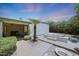 Private backyard featuring a hot tub, outdoor seating, and lush landscaping for relaxation and entertainment at 6911 E Thunderbird Rd, Scottsdale, AZ 85254