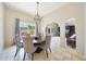 Elegant dining room with chandelier, tile floors and large windows at 6911 E Thunderbird Rd, Scottsdale, AZ 85254