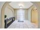 Spacious foyer features tiled floors, arched entryways and double door entry at 6911 E Thunderbird Rd, Scottsdale, AZ 85254