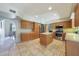 Open kitchen featuring stainless steel appliances and a center island at 6911 E Thunderbird Rd, Scottsdale, AZ 85254