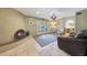 Cozy living room with stone fireplace and access to outdoor patio at 6911 E Thunderbird Rd, Scottsdale, AZ 85254