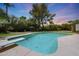 Inviting pool with a diving board and plenty of room for swimming in a large backyard with ample greenery at 6911 E Thunderbird Rd, Scottsdale, AZ 85254