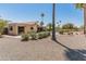 Expansive backyard featuring a pool, covered patio, and mature trees for ultimate privacy at 6931 E Pershing Ave, Scottsdale, AZ 85254