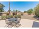 Secluded backyard featuring a seating area, mature trees, and a private fence at 6931 E Pershing Ave, Scottsdale, AZ 85254