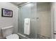 Bathroom with frosted shower, toilet, white tile, and towel rack, offering a clean and functional space at 6931 E Pershing Ave, Scottsdale, AZ 85254
