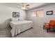Bright bedroom featuring a bed, and ceiling fan, creating a cozy and inviting space at 6931 E Pershing Ave, Scottsdale, AZ 85254