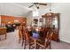 Elegant dining room featuring vaulted ceilings, a large window, and seamless access to the living area, perfect for hosting at 6931 E Pershing Ave, Scottsdale, AZ 85254