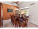 Inviting dining room featuring a vaulted ceiling and view of the sparkling pool at 6931 E Pershing Ave, Scottsdale, AZ 85254