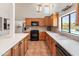 Bright kitchen featuring updated appliances and access to the backyard pool area at 6931 E Pershing Ave, Scottsdale, AZ 85254