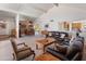 Living room with large windows and a dining room in the background at 6931 E Pershing Ave, Scottsdale, AZ 85254